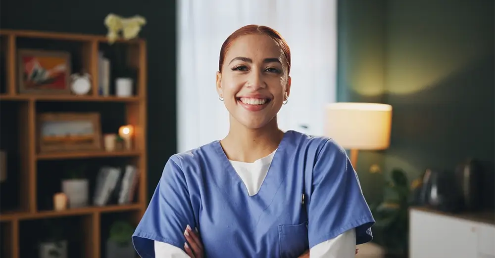 Nurse smiling at healthcare facility – Nurses Lounge career resources
