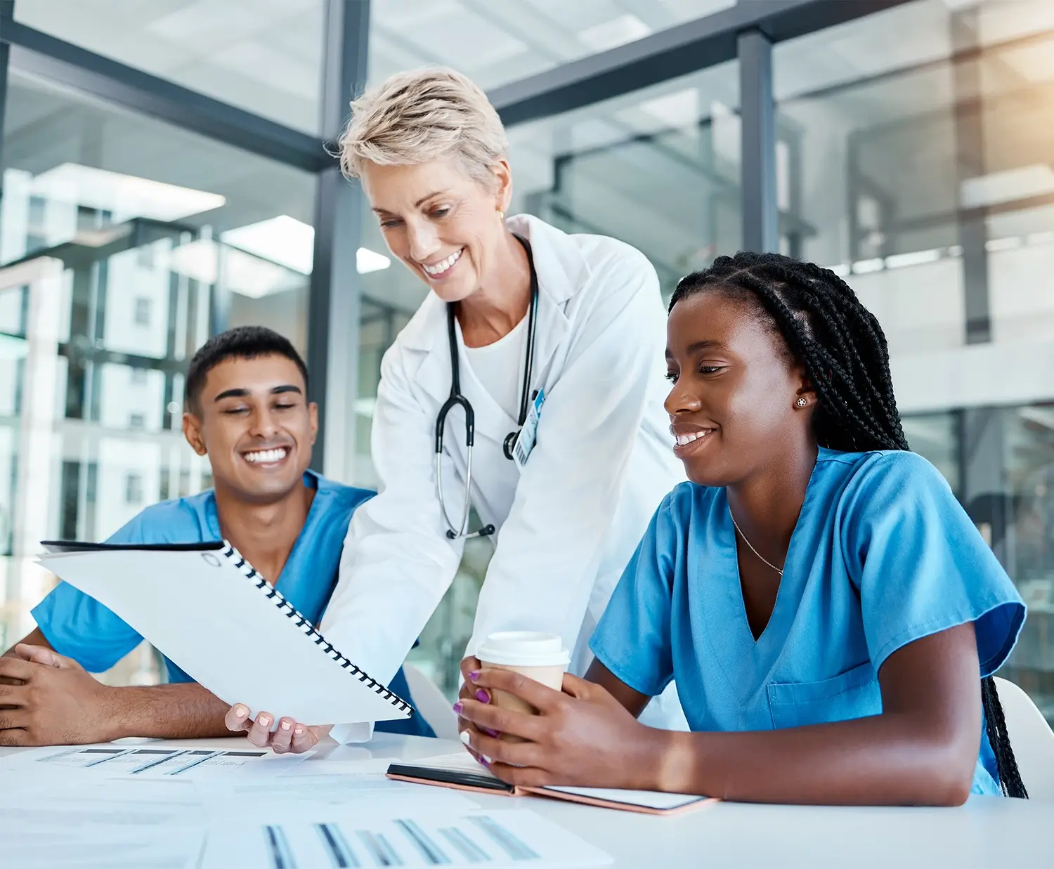 Professional reviewing nursing faculty jobs and online nursing teaching jobs on a laptop.